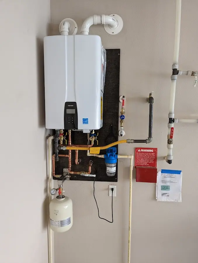 Professional plumber installing copper piping in a Crockett home